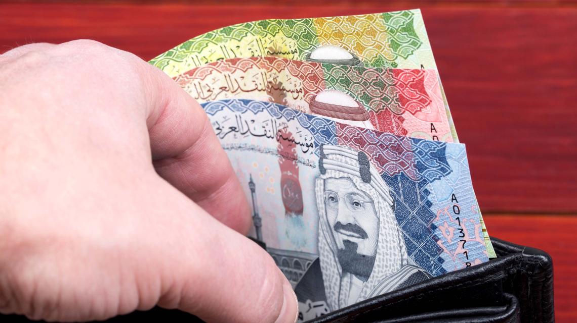 money-from-saudi-arabia-in-the-black-wallet-2021-12-09-21-42-32-utc.jpg