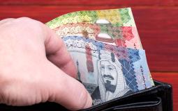 money-from-saudi-arabia-in-the-black-wallet-2021-12-09-21-42-32-utc.jpg