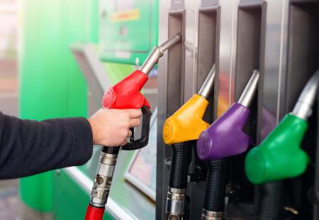 closeup-of-male-hand-holding-gas-red-pump-nozzle-2022-01-05-21-47-09-utc.jpg
