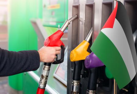 closeup-of-male-hand-holding-gas-red-pump-nozzle-2022-01-05-21-47-09-utc.jpg