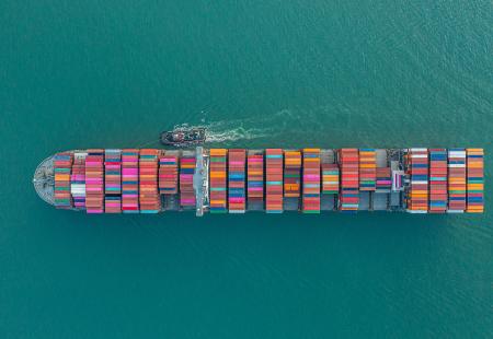 cargo-ship-carrying-container-for-business-import-2021-11-26-18-00-09-utc.jpg