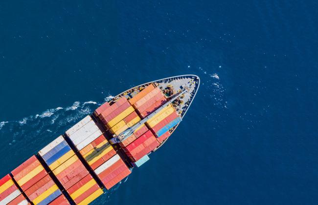 cargo-ship-full-loaded-with-containers-blue-sea-b-2021-08-29-11-45-03-utc.jpg