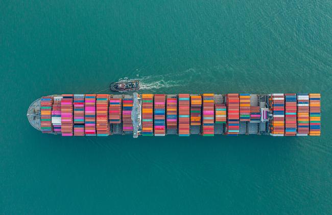 cargo-ship-carrying-container-for-business-import-2021-11-26-18-00-09-utc.jpg