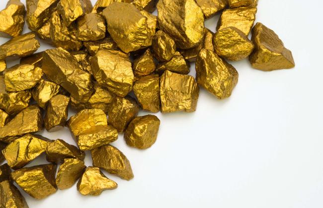 a-pile-of-gold-nuggets-or-gold-ore-isolated-on-whi-2021-08-29-01-05-23-utc.jpg