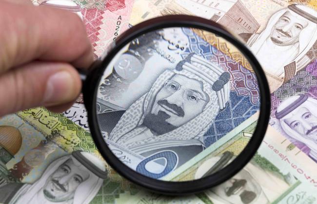 saudi-riyal-in-a-magnifying-glass-2021-08-29-11-43-04-utc.jpg