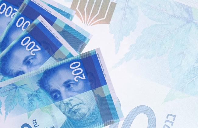 200-israeli-new-shekels-bills-lies-in-stack-on-bac-2021-08-30-04-33-31-utc.jpg