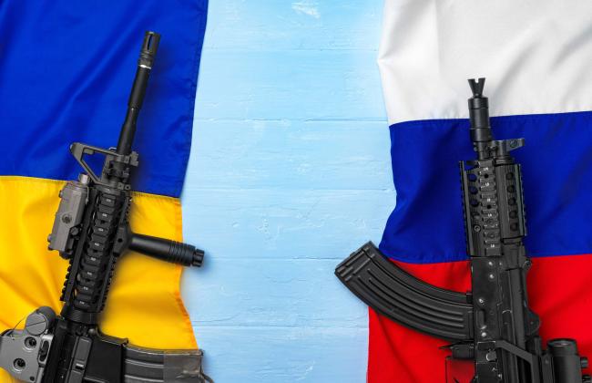 flags-of-russia-and-ukraine-with-weapon-rifles-2021-09-03-14-38-03-utc.jpg