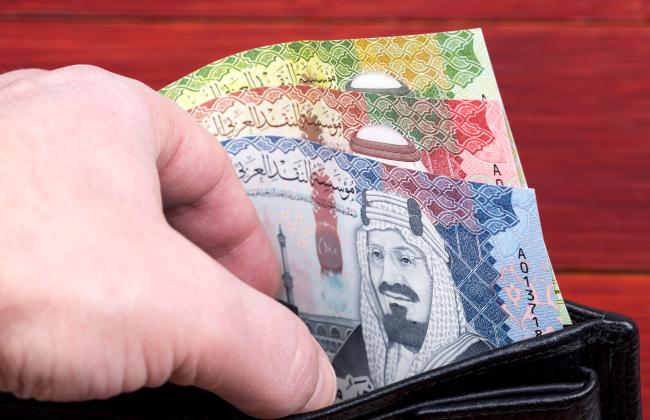 money-from-saudi-arabia-in-the-black-wallet-2021-12-09-21-42-32-utc.jpg